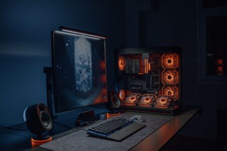 Dark gaming setup with glowing monitor, representing immersive single-player gaming atmosphere