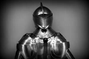 Dark armored warrior standing in dramatic lighting, representing Space Marine aesthetic