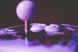 Bandai Namco’s Soul Calibur Silence Is Reviving Dead or Alive 6 A gaming controller resting on a surface, representing fighting game culture and competitive play
