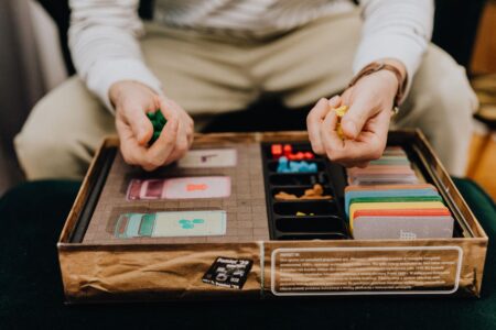 Close-up of a strategy board game with pieces arranged on a map, representing grand strategy gameplay