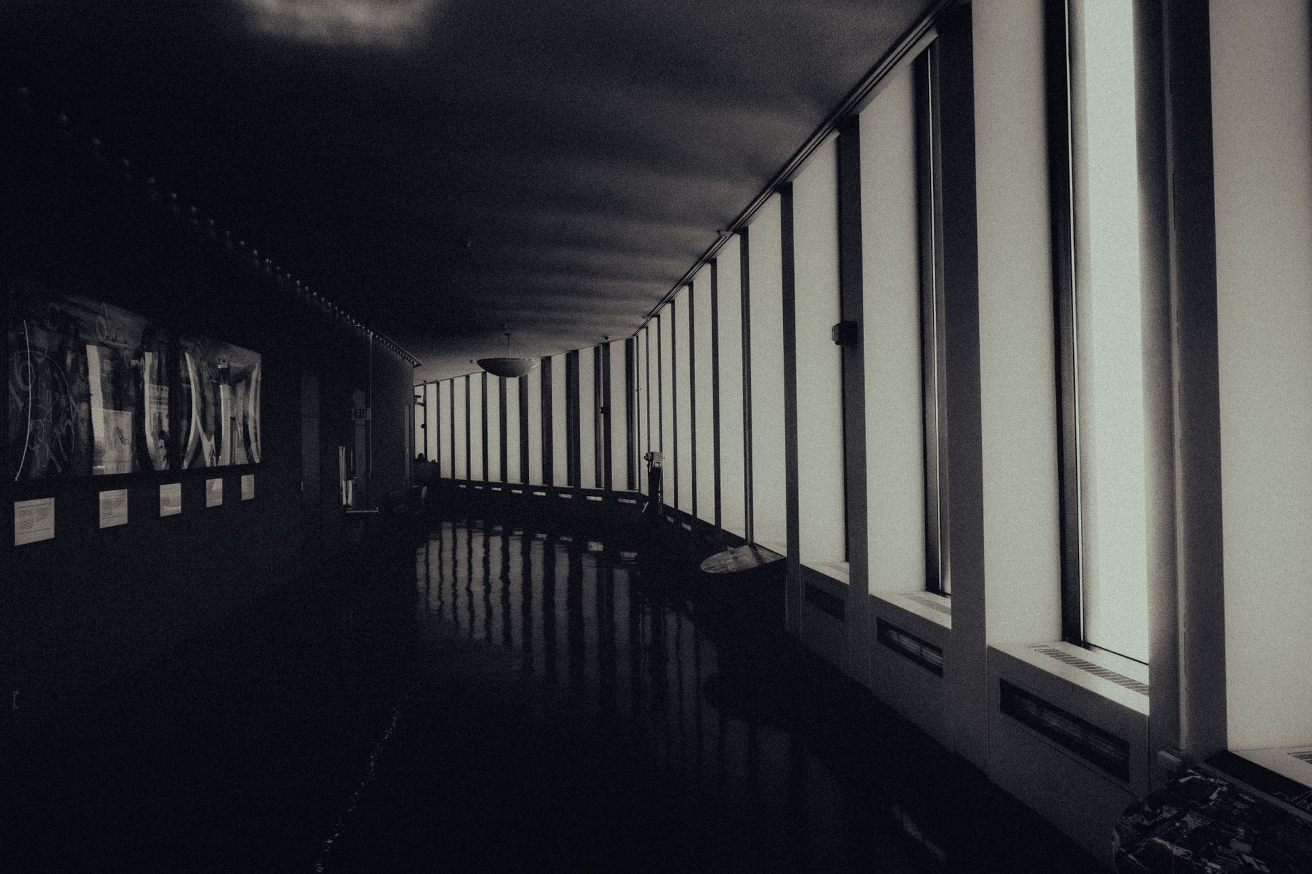 A dimly lit, fog-filled hallway evoking the atmosphere of a horror game environment