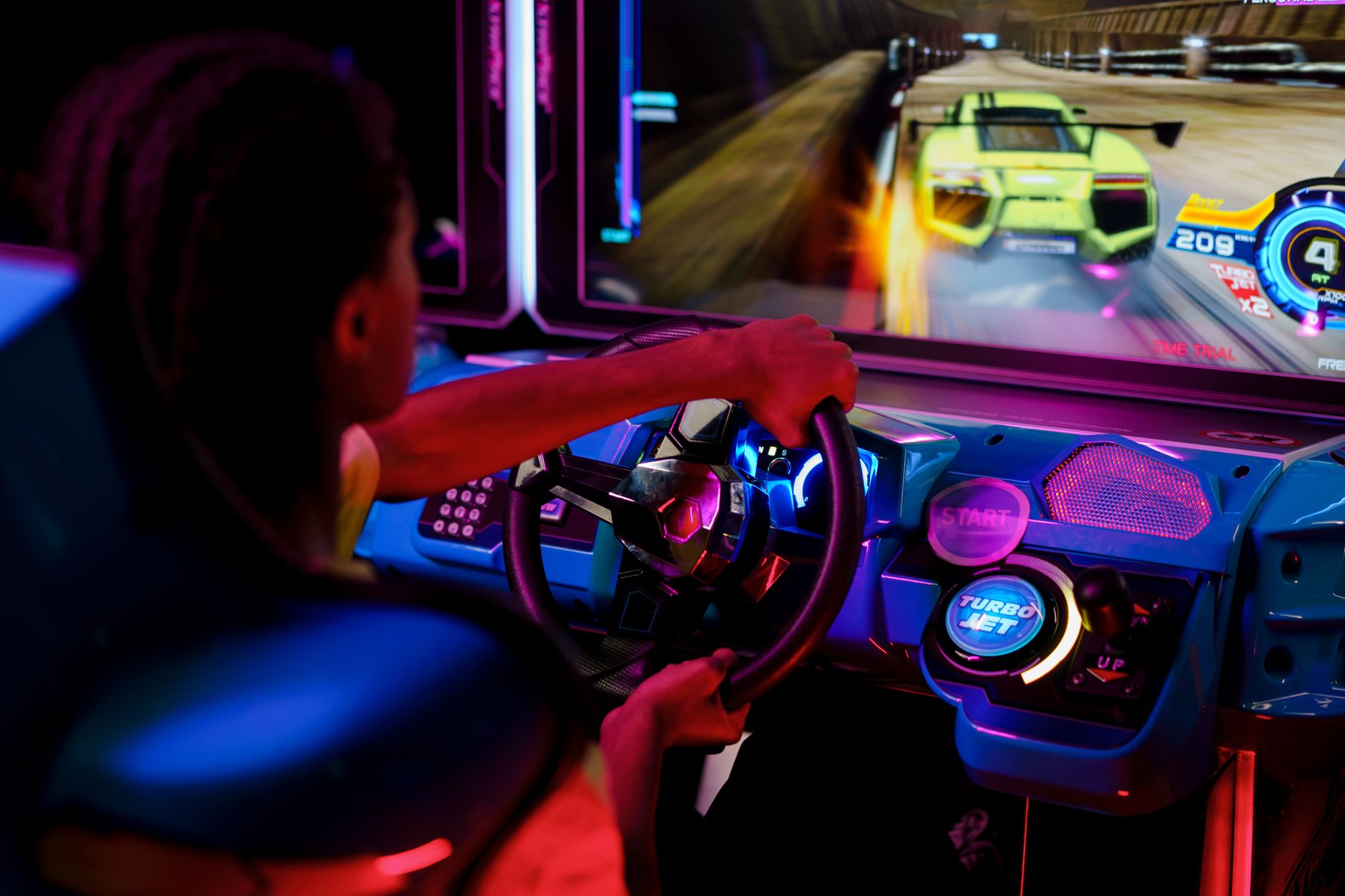 Close-up of a racing video game being played on a television screen