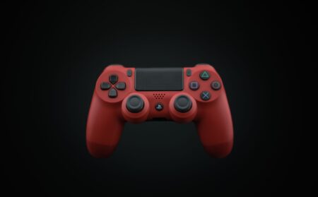 A gaming controller resting on a dark surface, representing the anticipation of upcoming game releases