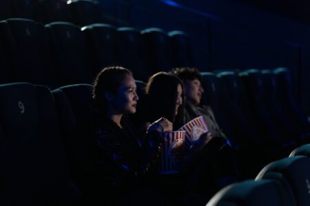 Mojang’s Minecraft Movie Buzz Is Shelving Legends Runs Audience watching a movie in a darkened cinema theater