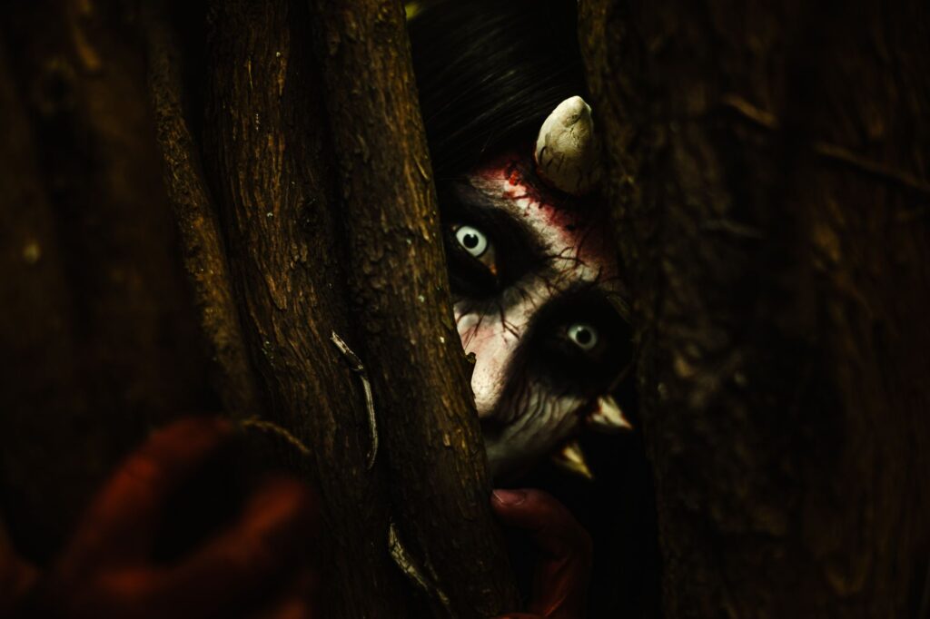 Dark atmospheric forest environment evoking the visual style of indie metroidvania games