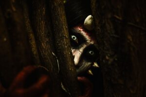 Dark atmospheric forest environment evoking the visual style of indie metroidvania games