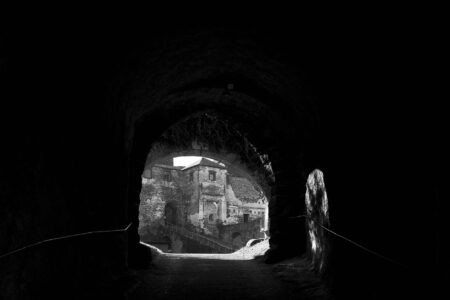 A dark gothic castle exterior evoking the atmosphere of classic Castlevania games