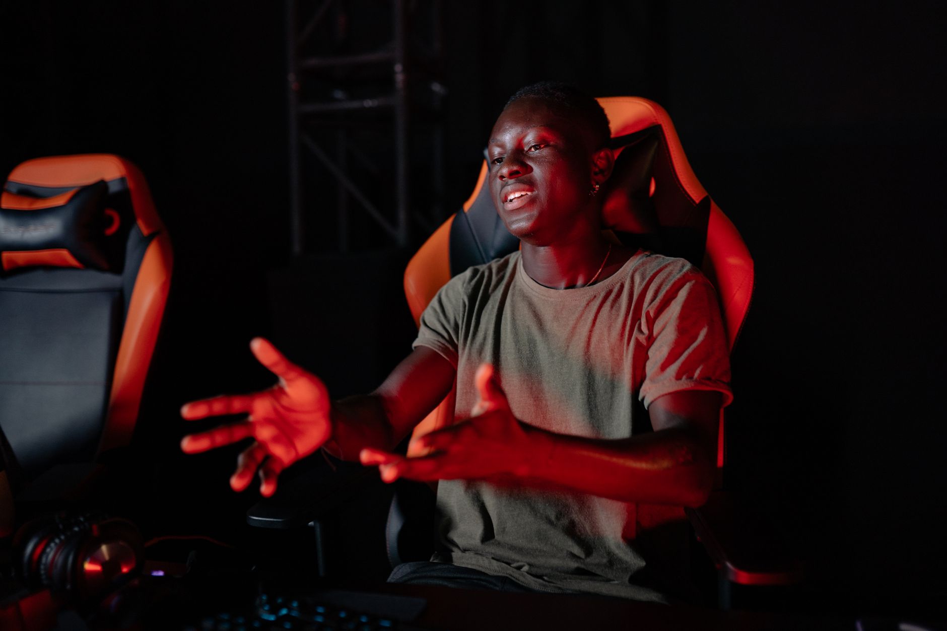 A gamer sitting at a desk with a frustrated expression, representing burnout from competitive online games