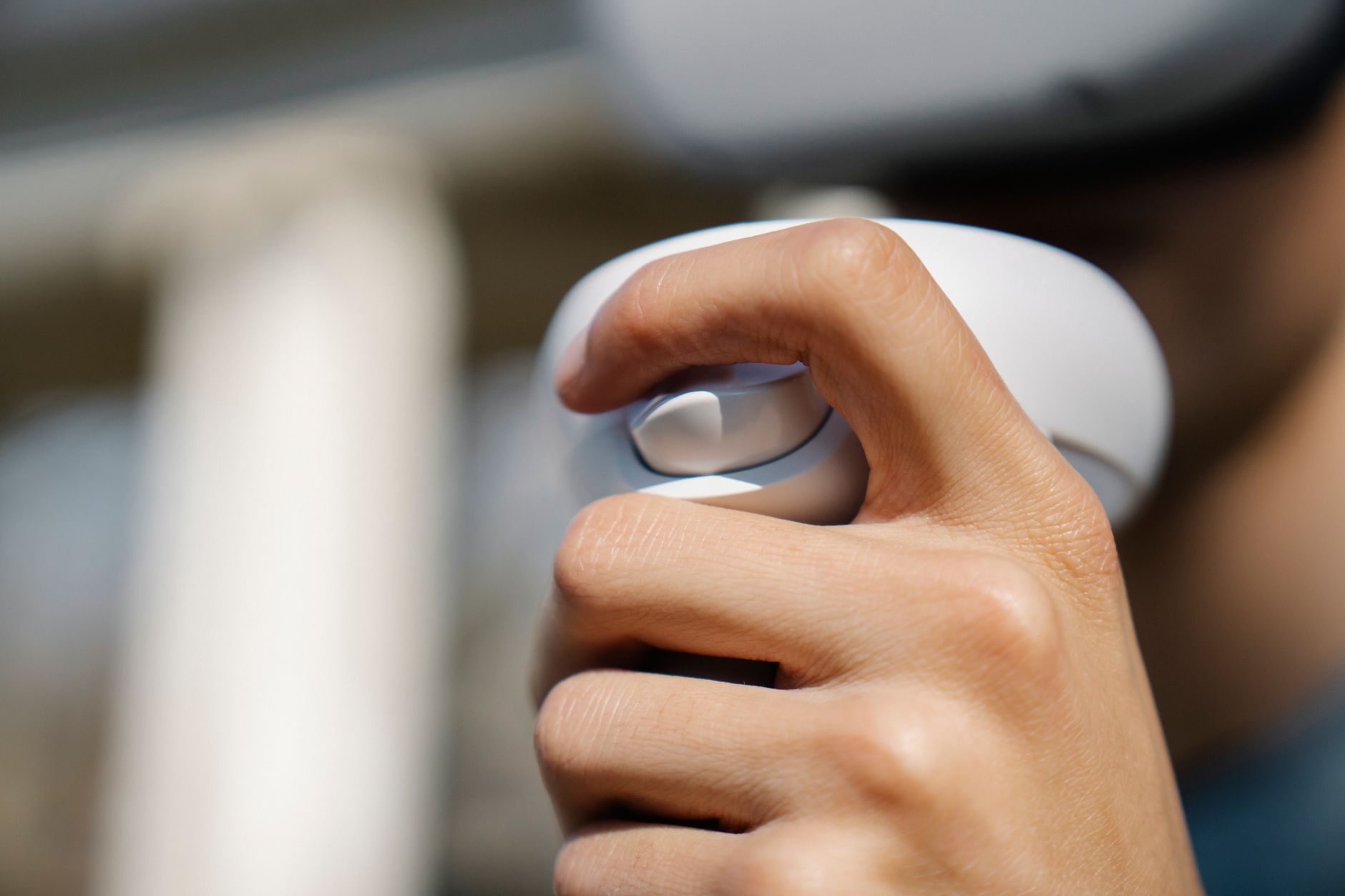 Close-up of a game controller, symbolizing the hands-on monster hunting experience in Capcom's titles