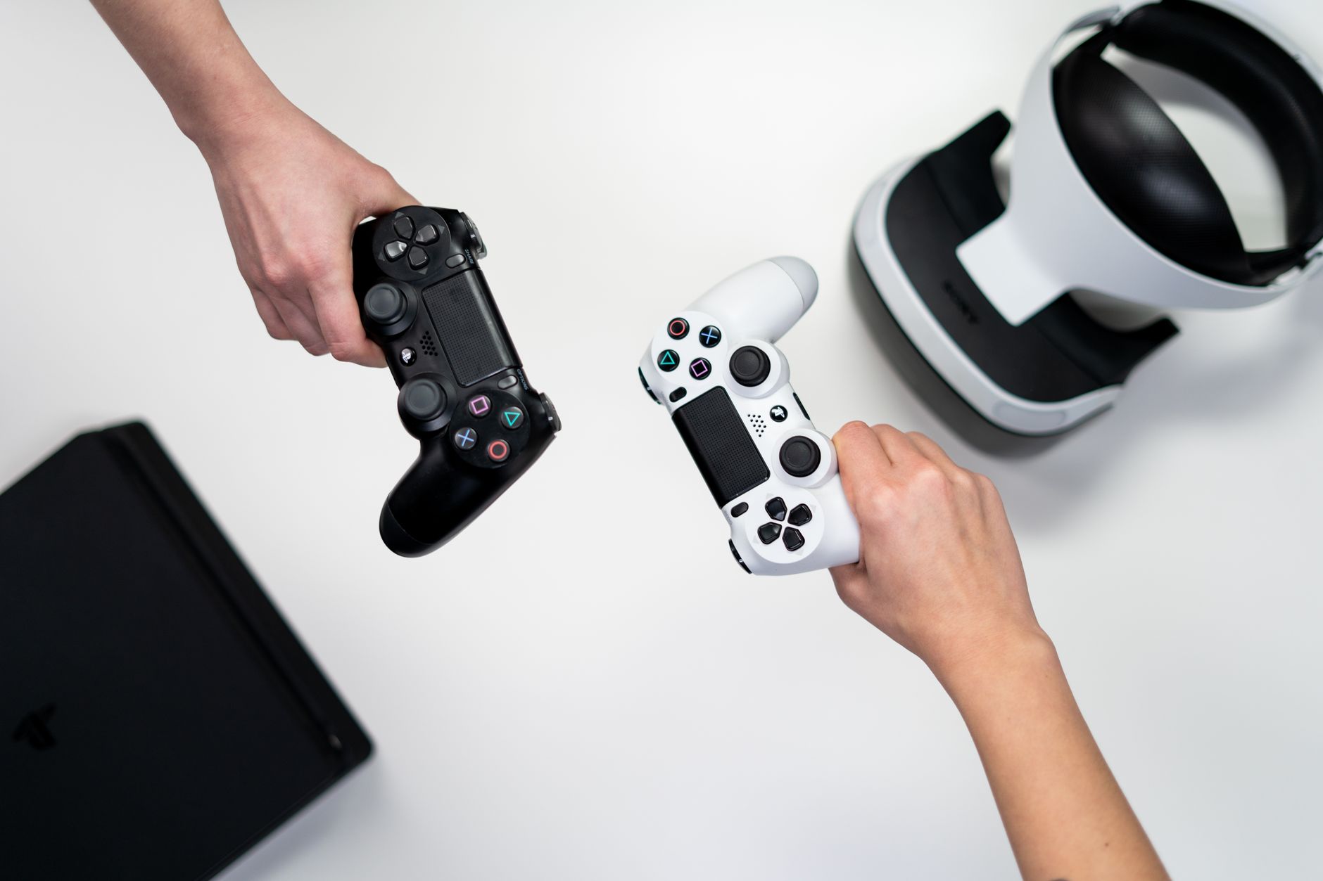 Close-up of a gaming controller resting on a desk with soft background lighting