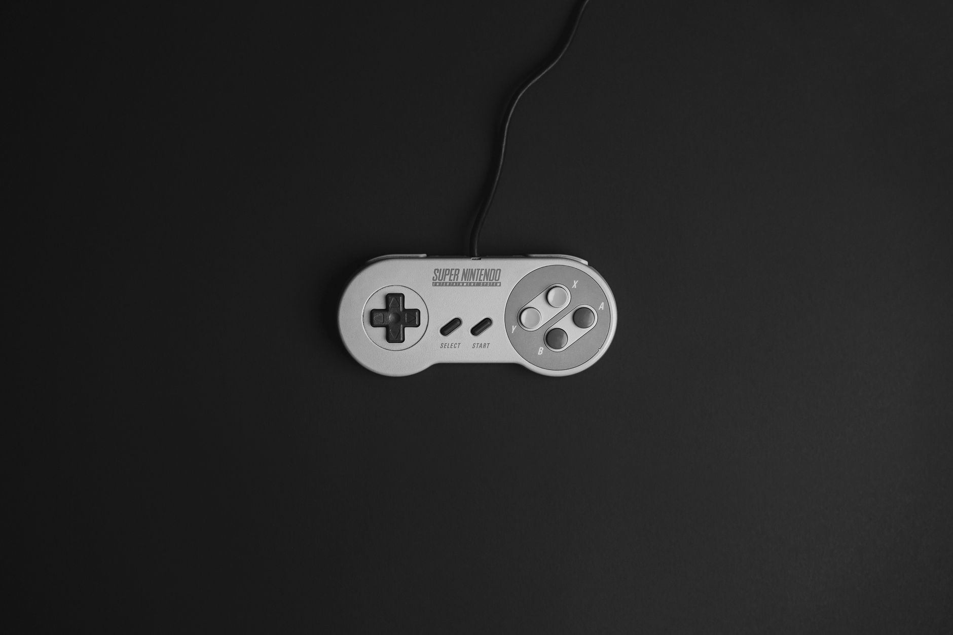 A vintage gaming controller resting on a surface, representing classic console game replays