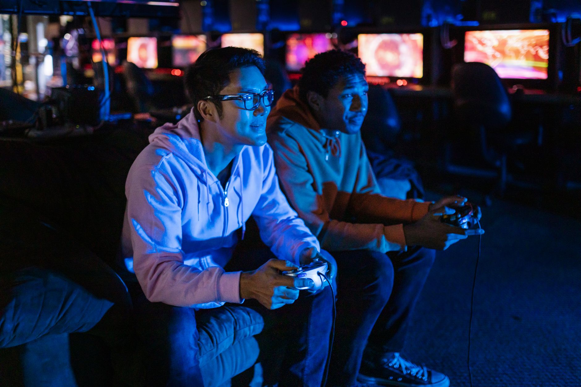 A person playing a video game late at night, representing players returning to older RPG titles