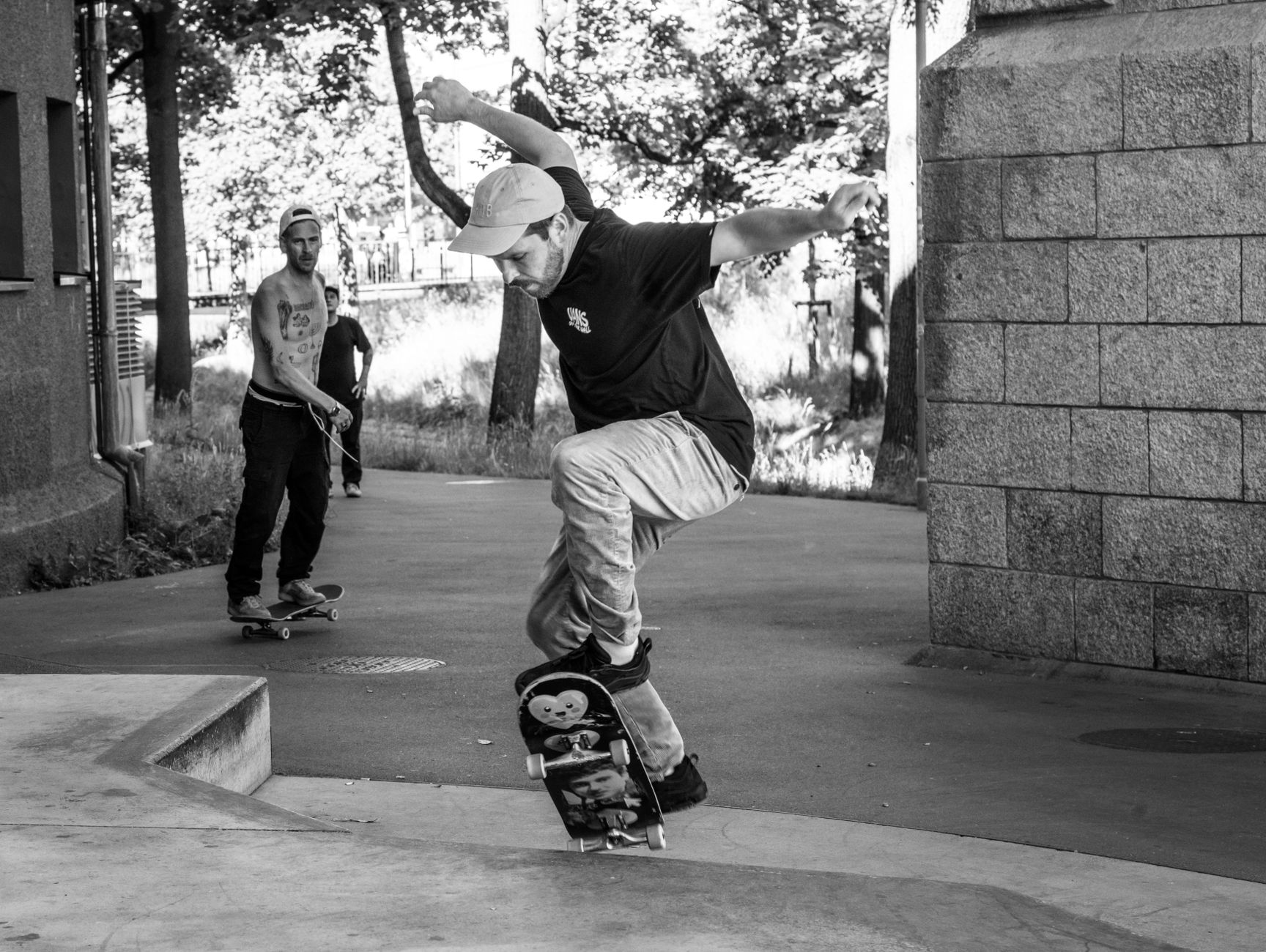 Skateboarder performing a trick on a city street ledge