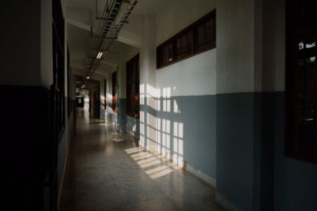 Rockstar’s Bully 2 Silence Is Sending Fans Back to Scholarship Edition Empty school hallway with lockers, representing the Bullworth Academy setting from the Bully video game
