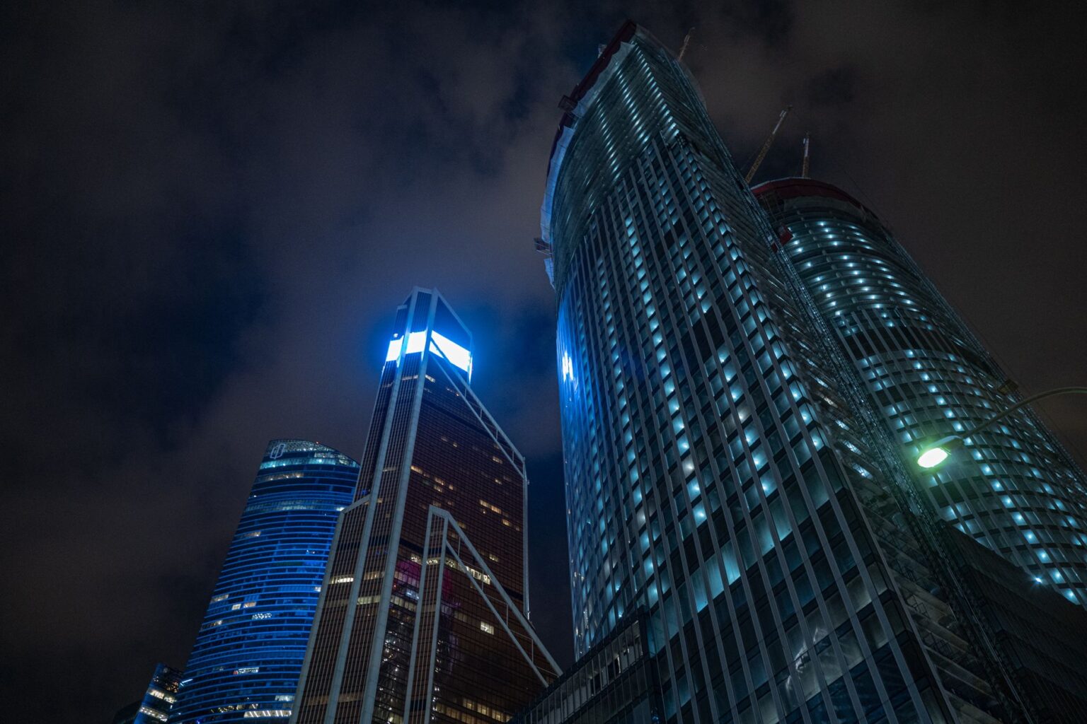 A dark futuristic city skyline representing the atmospheric setting of upcoming sci-fi games like Pragmata
