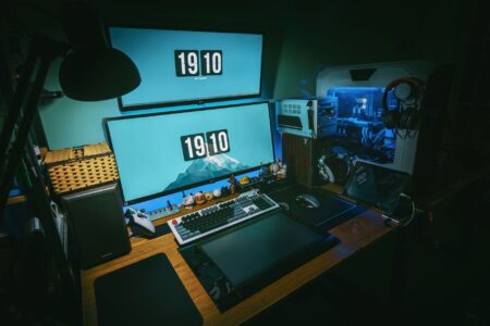 Valve’s Deadlock Beta Silence Is Pushing Players Back to Dota 2 A gaming PC setup with a monitor displaying a competitive multiplayer game