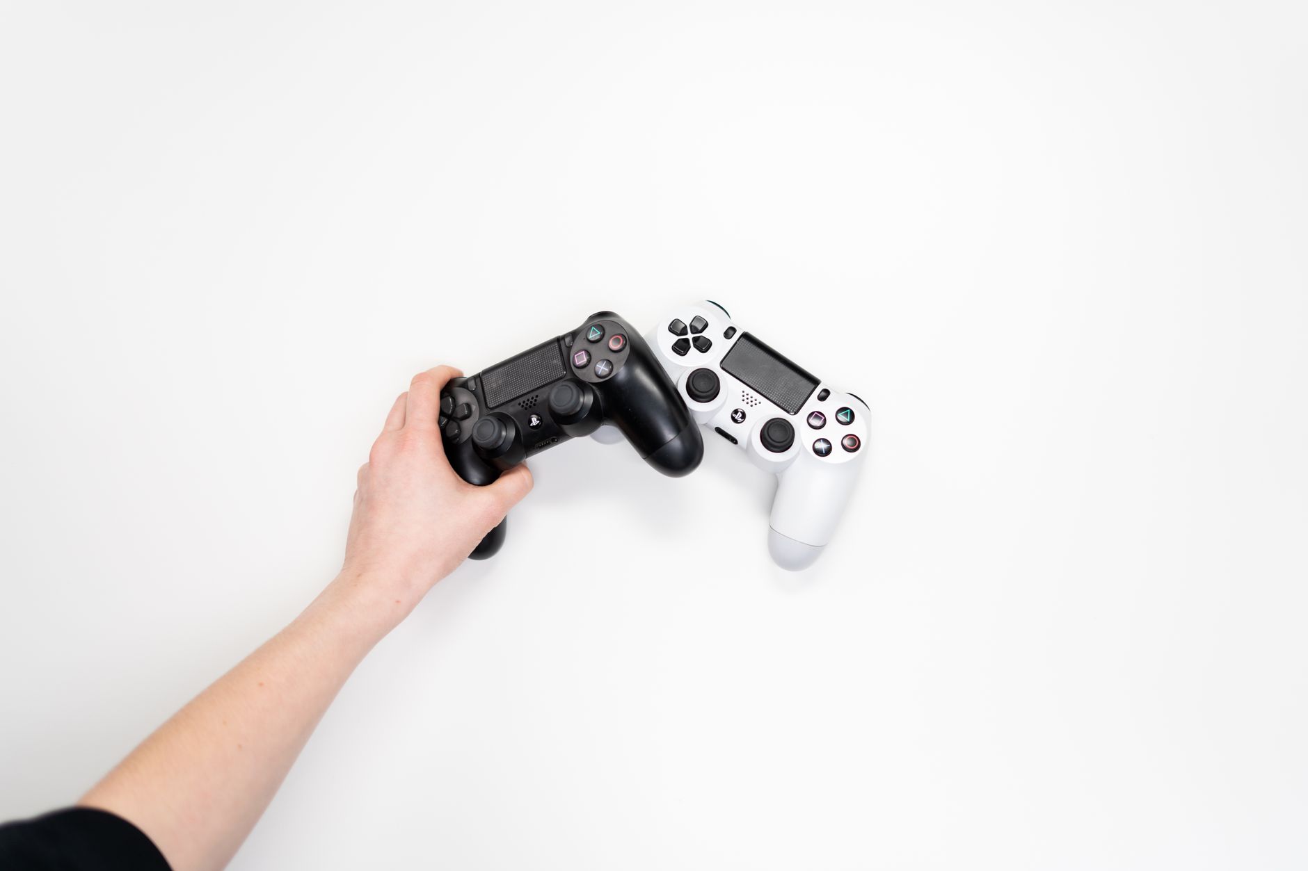 Close-up of hands holding a gaming controller during an intense gaming session