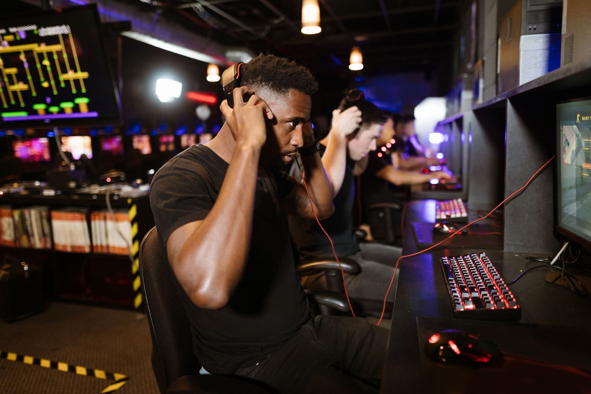 Group of players wearing gaming headsets, coordinating during a multiplayer session