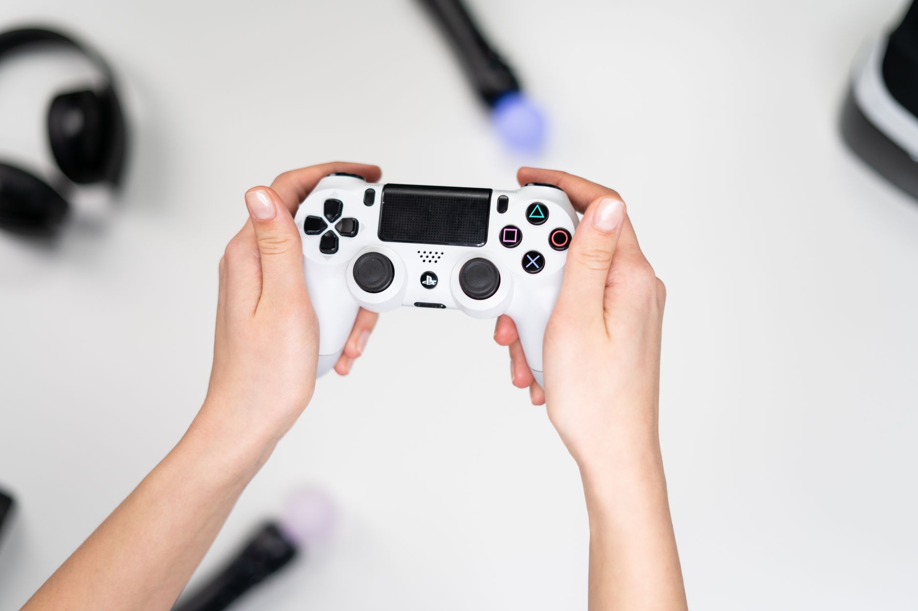 A player holding a game controller during an intense gaming session