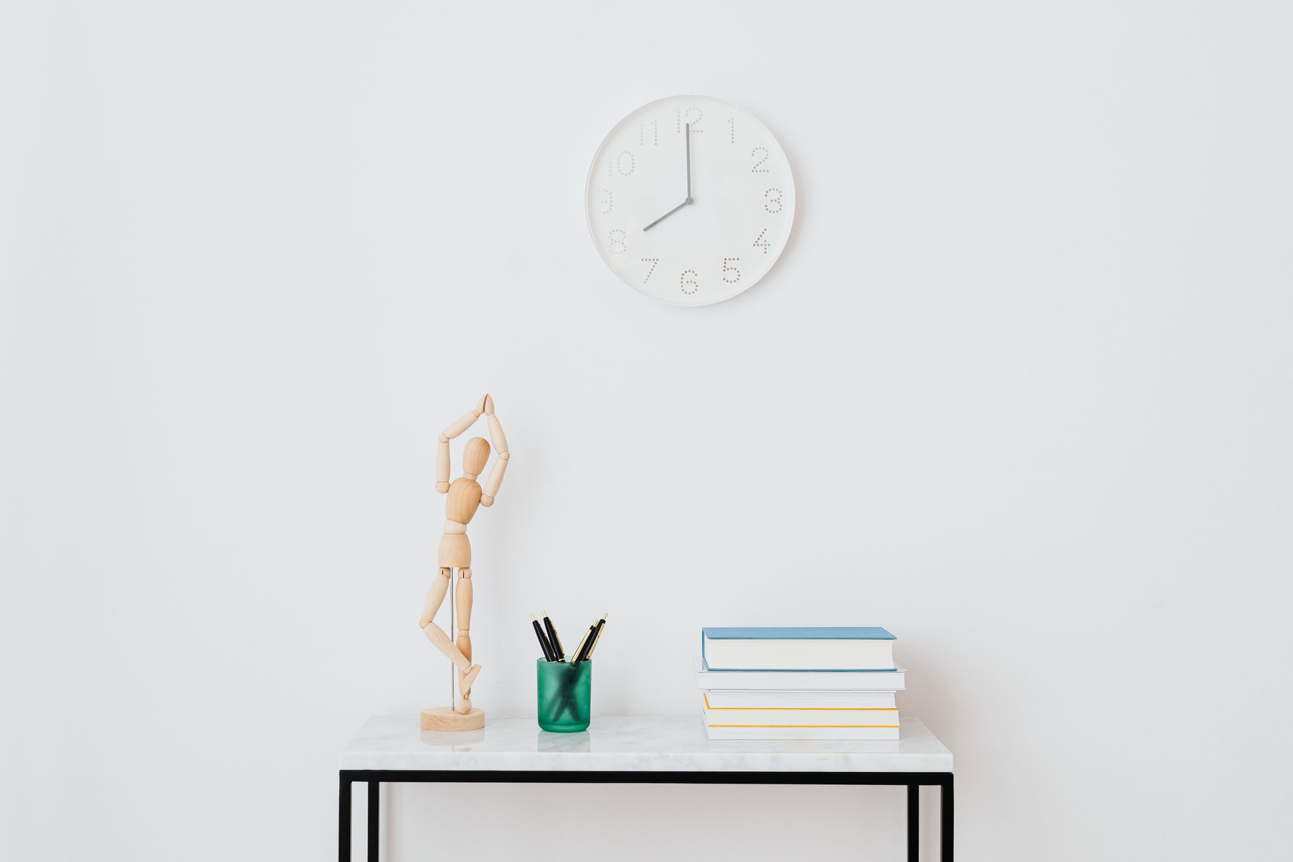 A clock on a desk symbolizing the wait for a gaming announcement or content update