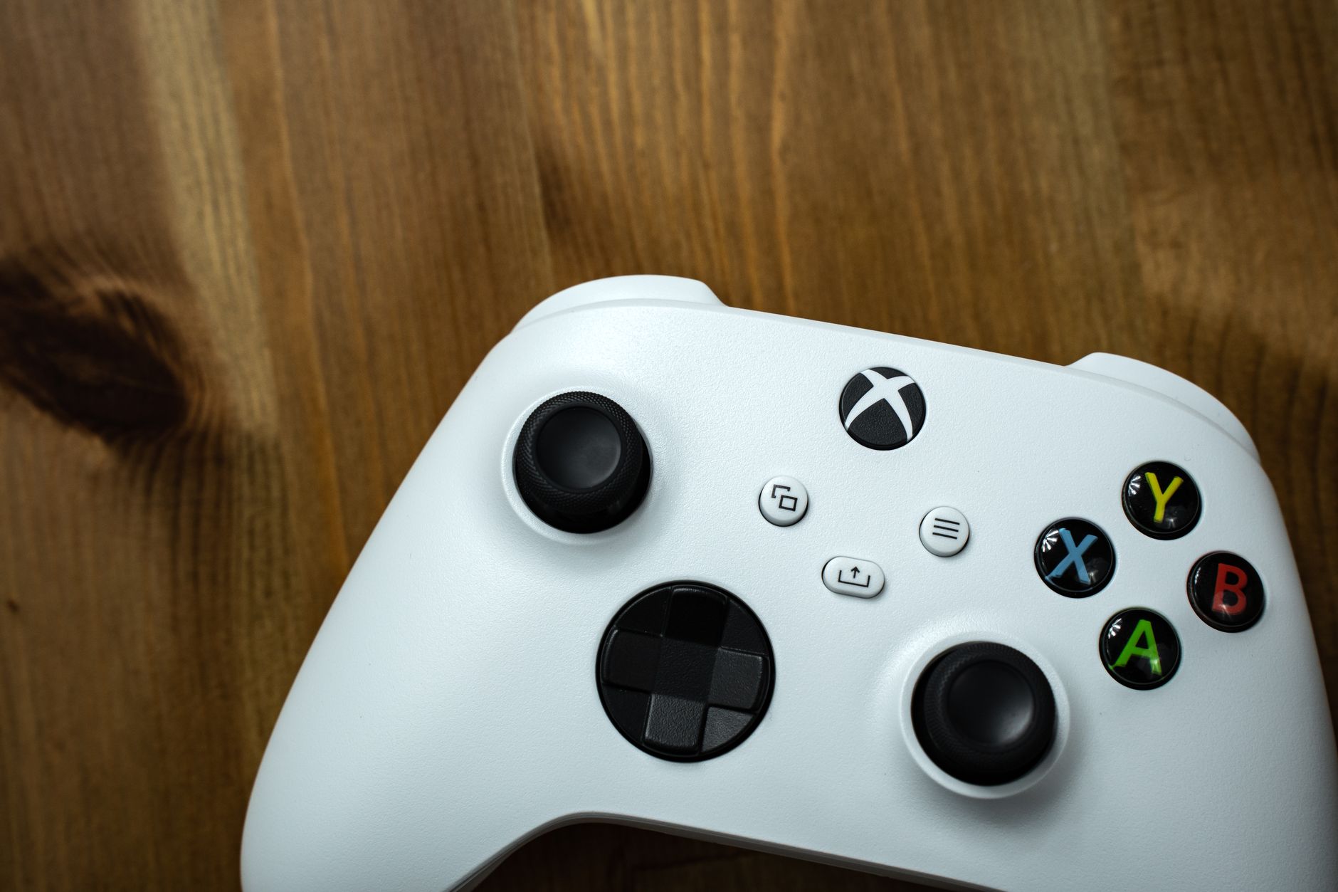 Close-up of an Xbox controller resting on a desk