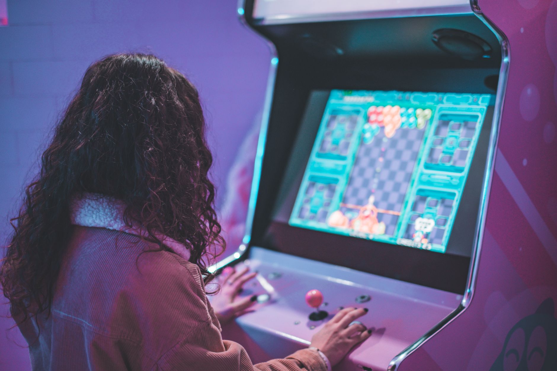 Close-up of a television screen showing an older video game with atmospheric visuals