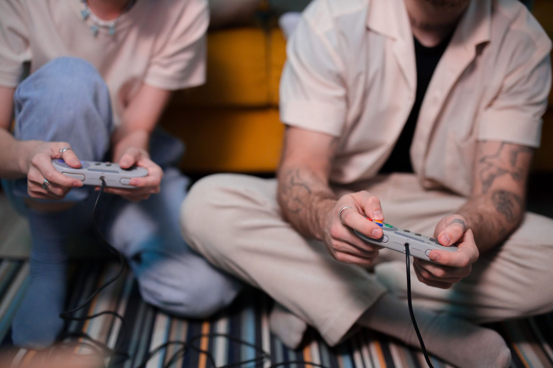 An old video game controller resting on a wooden surface