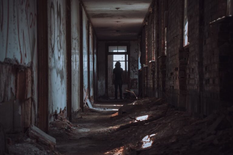 Namco’s Splatterhouse Silence Is Sending Fans Back to 2010 Dark and eerie hallway with dim lighting evoking horror game atmosphere