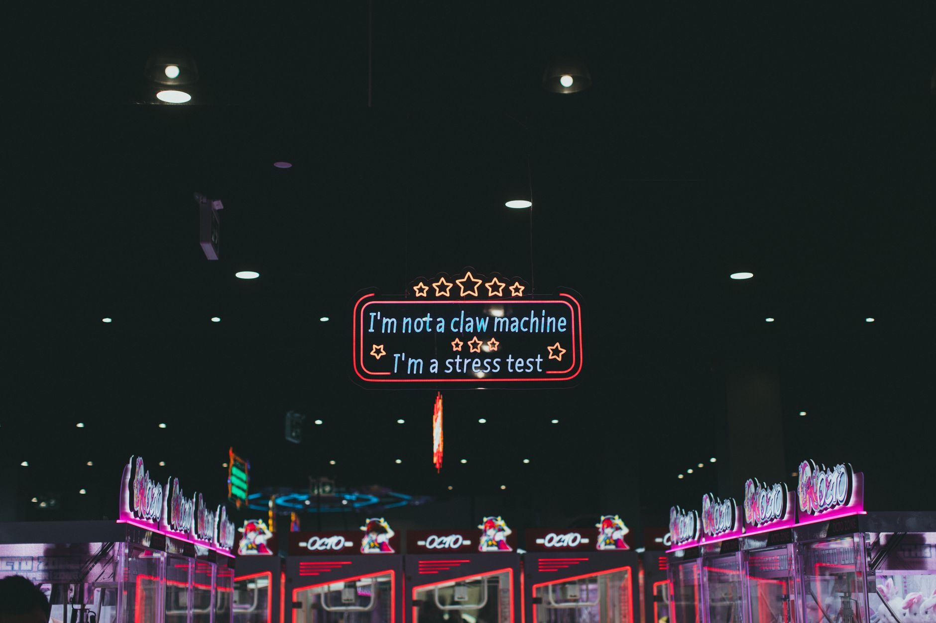 Colorful arcade game screens glowing in a dark room, evoking nostalgia for classic gaming experiences