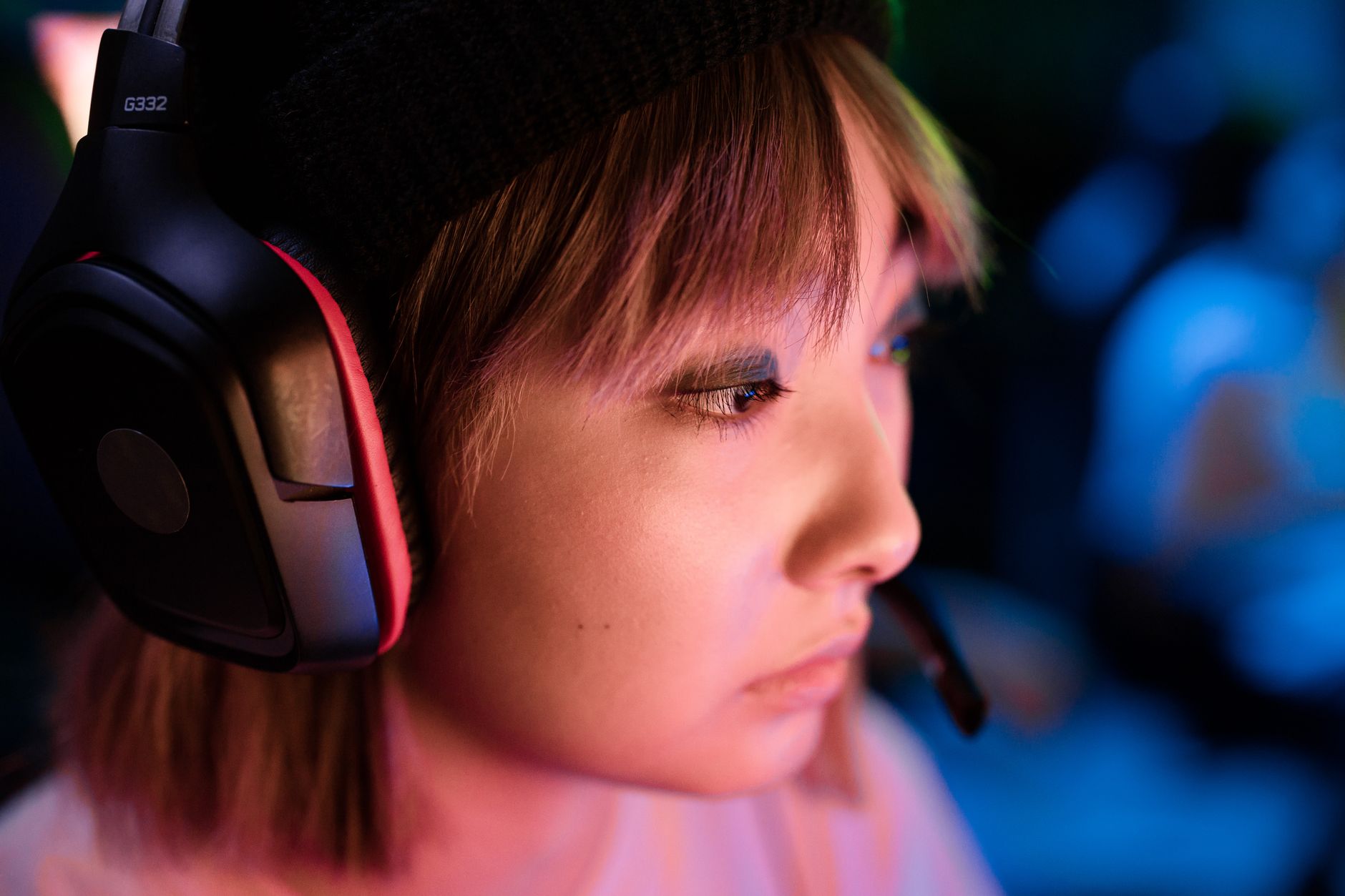 Close-up of a gamer wearing a headset during an online match