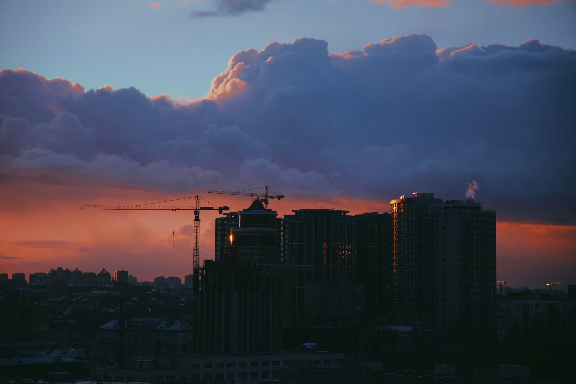 A dramatic city skyline above clouds, visually echoing the floating city of Columbia from BioShock Infinite